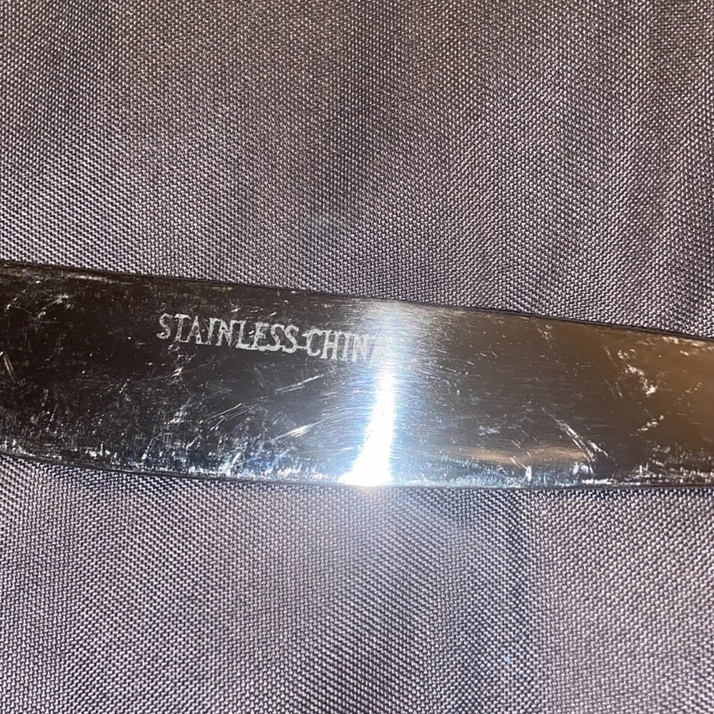 Set of four, new in plastic, stainless steel flatware knives